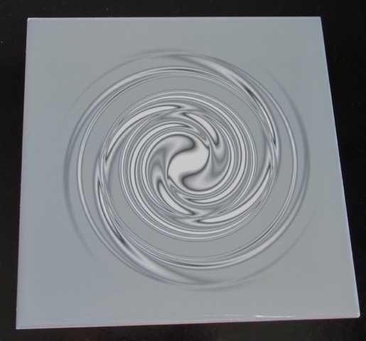 A gray spiral tile by Gingezel at Zazzle.