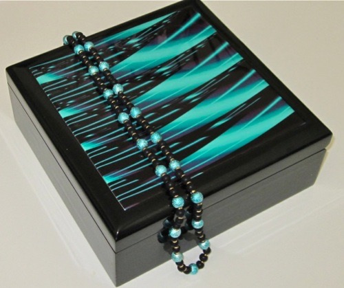 One of the abstract tiles inlaid in the cover of a box. Gingezel at Zazzle.